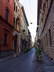 Fototapeta na wymiar Pedestrian empty street with building facades, Milan, Italy