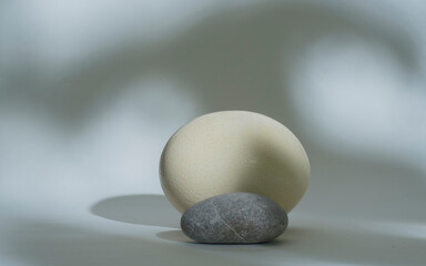 Fototapeta na wymiar zen stones and egg isolated on white background .minimal background podium for product
