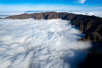 Aerial panoramic above the clouds at the beautiful Caldera de Taburiente National Park in La Palma - Canary Islands	