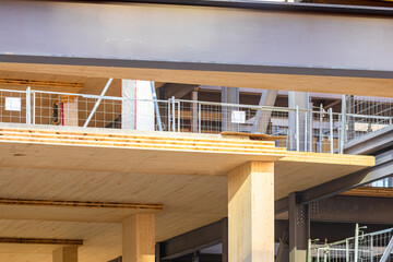 Detail of a laminated floor panel and vertical column of a mass timber multi story green,...