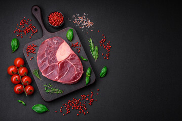 Fresh beef ossobuco steak with salt, spices and herbs