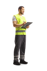 Full length shot of a worker in a reflective vest writing a document and smiling