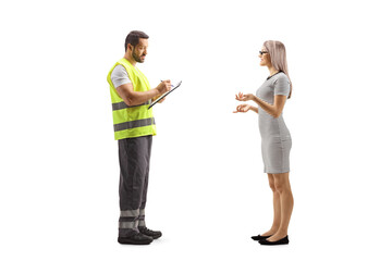 Young woman talking to a road assistance agent in a reflective vest