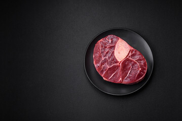 Fresh beef ossobuco steak with salt, spices and herbs
