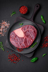 Fresh beef ossobuco steak with salt, spices and herbs
