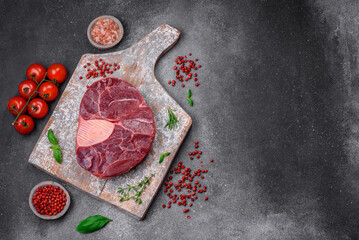 Fresh beef ossobuco steak with salt, spices and herbs
