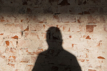 Shadows on red brick wall, abstract square interior background