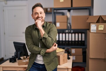 Young caucasian man ecommerce business worker smiling confident at office