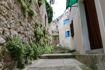 Fototapeta na wymiar Villageof Plomin, old abandoned houses in ancient town of Plomin, Croatia, street in the old town