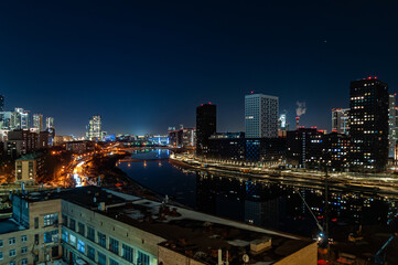 Night view of the city of Moscow, Moscow City, Moscow river, Yauza river, the capital of Russia from a bird's eye view. View from above. New area, building high. Urban landscape.