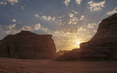 Fototapeta na wymiar Morning sun shines over rocky desert formations, typical landscape in Al Ula, Saudi Arabia