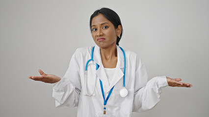 African american woman doctor standing clueless over isolated white background