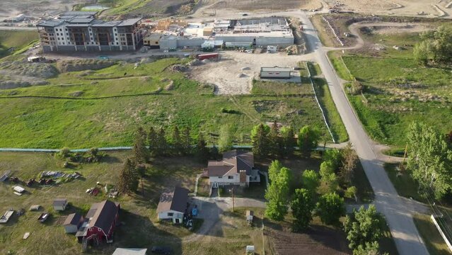 Aerial view of suburban residential developments spreading over beautiful farmland. 