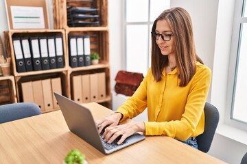 Young woman business worker using laptop working at office