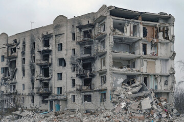 An exterior view of a high-rise residential building heavily damaged by after the bombing in Izium...