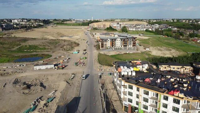 Aerial view of suburban residential developments spreading over beautiful farmland. 