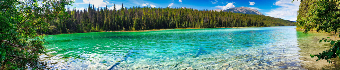 Panoramic view of the 5th lake in the Valley of Five Lakes region near Jasper National Park in the Canada Rockies