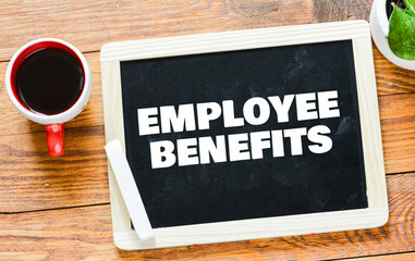 EMPLOYEE BENEFITS on a chalkboard.