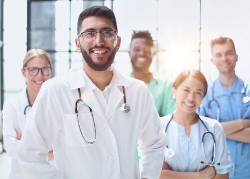 Group of specialists in white overalls at advanced training courses