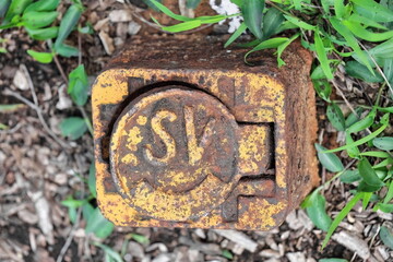 Rusty lid of sluice valve of the city's water supply, Glenmore Road-Ormond Street corner,...