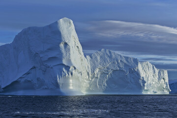 Fototapeta na wymiar Huge iceberg sits aground in the Disco bay in Greenland