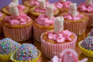 cupcakes with pink frosting and sprinkles