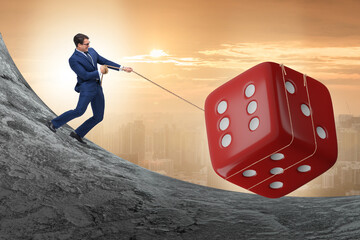 Uncertainty concept with businessman and dice