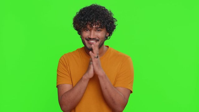 Villain idea. Sneaky young indian man conspiring scheming, thinking over tricky plan with cunning expression, pondering revenge or evil joke prank. Hindu guy isolated on green chroma key background