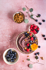 Blueberry Smoothie Bowl with Granola, Banana, and Chia Seeds, Healthy Food, Vegan or Vegetarian Diet Food Concept, Bright Background