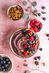 Blueberry Smoothie Bowl with Granola, Banana, and Chia Seeds, Healthy Food, Vegan or Vegetarian Diet Food Concept, Bright Background
