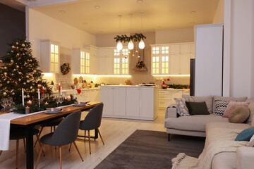 Cozy spacious kitchen decorated for Christmas. Interior design