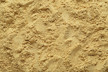 Aromatic mustard powder as background, top view