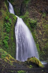 Fototapeta na wymiar Waterfalls in lush green forest. Rain forest in Columbia River gorge. Oregon. USA