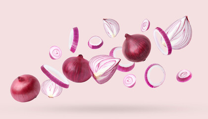 Whole and cut fresh red onions falling on light pink background