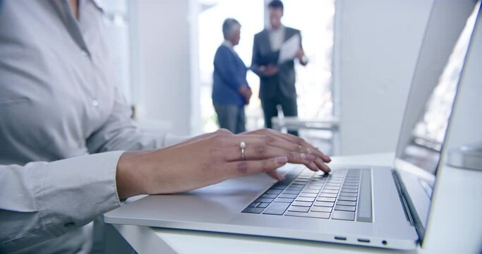Hands, woman and laptop typing in busy office for research, email or editing information online. Closeup, worker and computer keyboard to start digital planning, internet connection or web technology