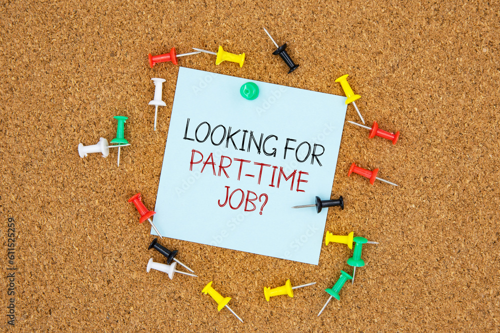 Poster looking for part-time job text on light blue post-it paper pinned on bulletin cork board surrounding