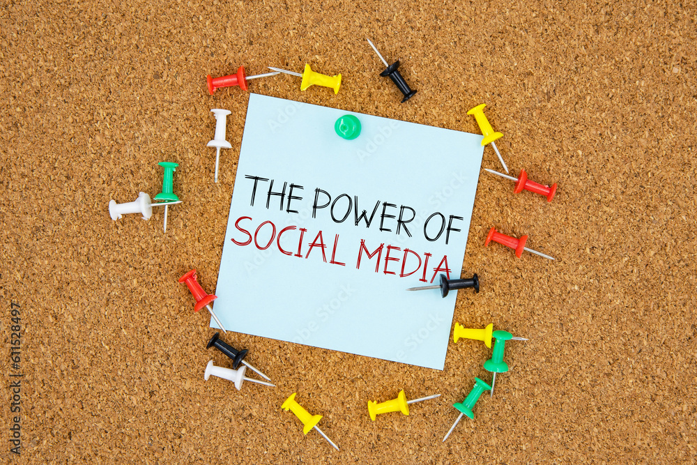 Poster the power of social media text on light blue post-it paper pinned on bulletin cork board surrounding