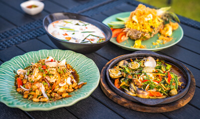 Thai food dishes in a restaurant beachfront in Hua Hin, Thailand