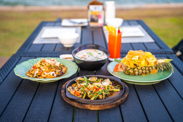 Thai food dishes in a restaurant beachfront in Hua Hin, Thailand