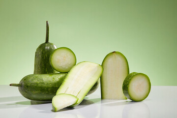 Front view of slices of winter melon known as wax gourd or ash gourd decorated on a green...
