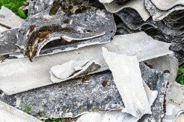 A pile of asbestos removed from an old roof. Hazardous waste prepared for disposal.