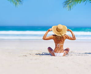 Travel, beach and woman on island for holiday, tropical adventure and vacation in Mauritius. Tropical mockup, ocean and back of female person relax in bikini by sea for tourism, summer and getaway