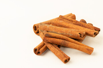 Cinnamon sticks on white background.