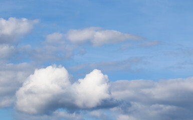 Background of blue sky with white clouds