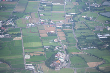 Fototapeta premium Aerial view of the city in Thailand, photograph from the plane on a foggy day
