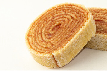 Brazilian northeast dessert known as roll cake isolated on white background.