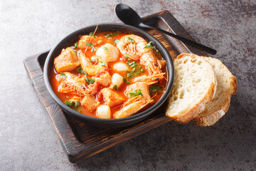 Brudet is a hearty fish stew from the Dalmatia region of Croatia, similar to Greek Bourdeto and Italian Brodetto close-up in a bowl on the table. Horizontal