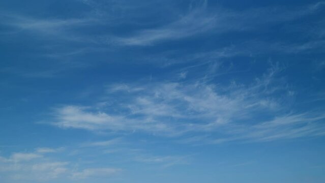 Tropical summer sunlight ray. Good weather environment in air. White cirrus cloud time lapse on blue sky. Timelapse.
