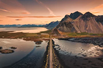 Photo sur Plexiglas Atlantic Ocean Road Beautiful sunrise over Vestrahorn mountain with road into the black sand beach in Atlantic ocean at Stokksnes on the southeastern at Iceland