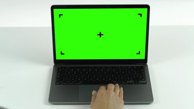 Empty Green Screen Display Laptop Swipe Left Single on a White Background.  Green Mock-up Monitor for Video Call, Website Template Presentation or Game Applications. Blank Screen Monitor 3D render.